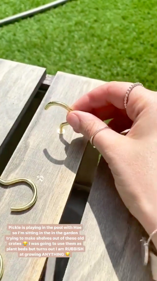  She used screw-in hooks and lined one of the timber panels