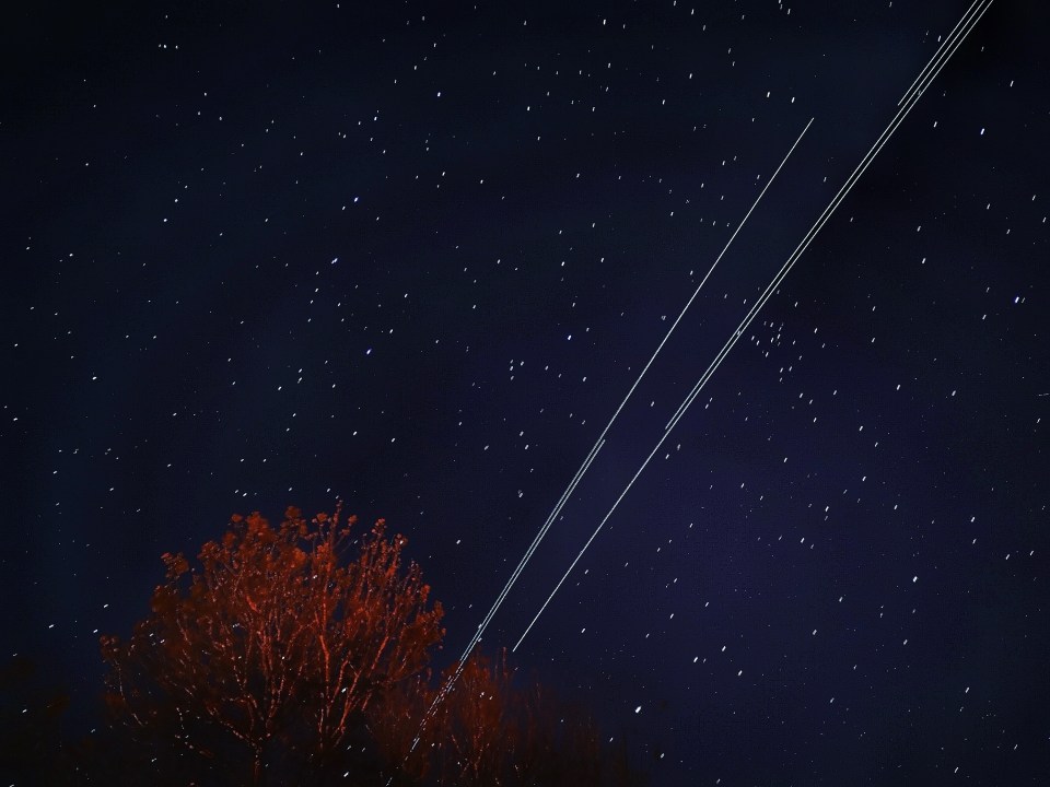  The satellites orbit the planet in groups of 20 or more, creating 'streaks' across the sky