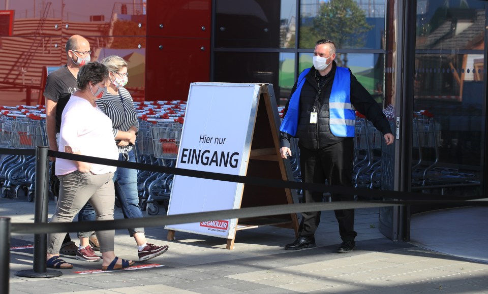 People enter a furniture shop as restrictions ease across parts of Germany