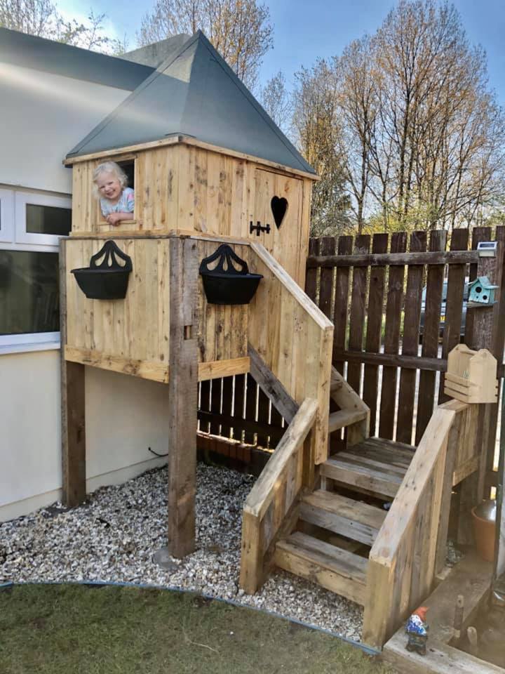  The cheerful Mila loves her new playhouse