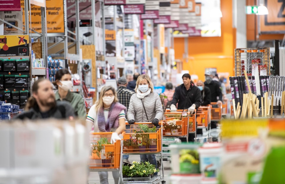 German residents queue in reopened DIY stores