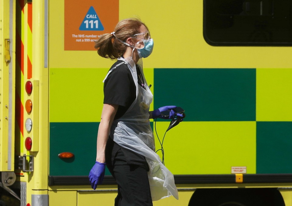  A medical worker wearing personal protective equipment (PPE)