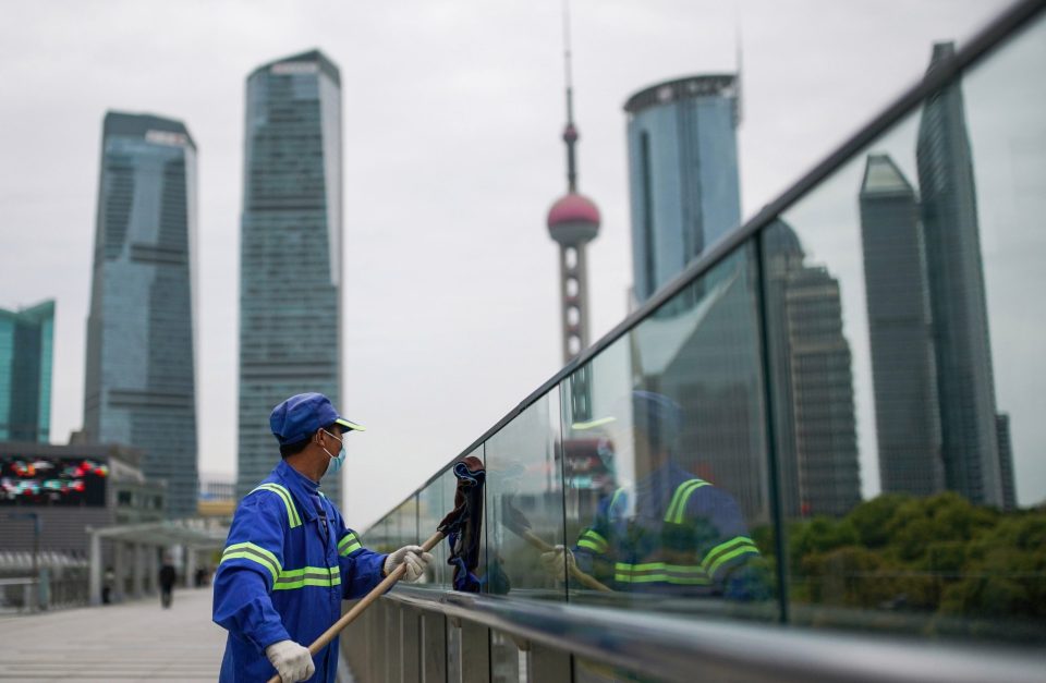  A cleaner wearing a mask after the peak of the pandemic in Shanghai - the Chinese government acted quickly to identify and isolate cases