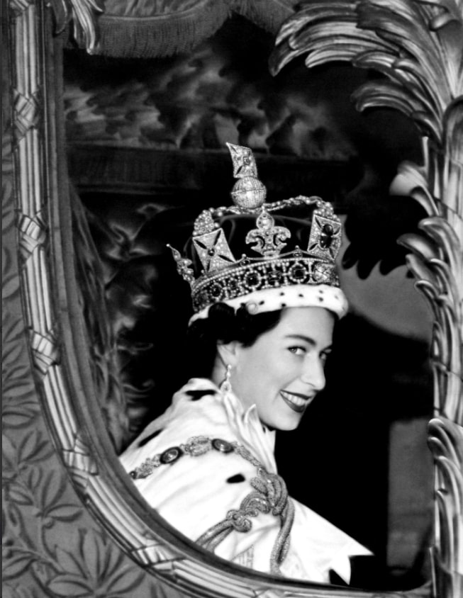  Queen Elizabeth II smiles for the crowd from her carriage as she leaves Westminster Abbey, London after her Coronation