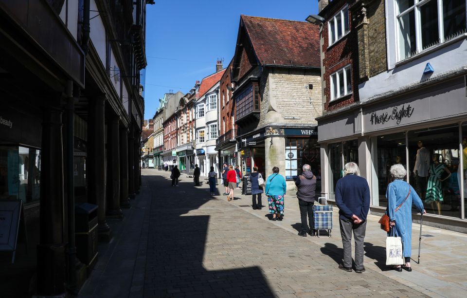  Social distancing has been in place at this Winchester Post Office queue