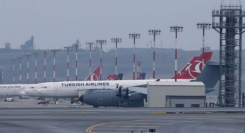 An RAF plane sits idly on the runway in Turkey waiting to bring back PPE for the NHS