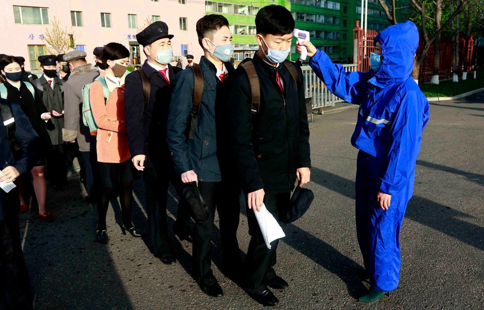  Students get their temperatures checked as part of coronavirus precautions at Kim Chaek University of Technology in Pyongyang