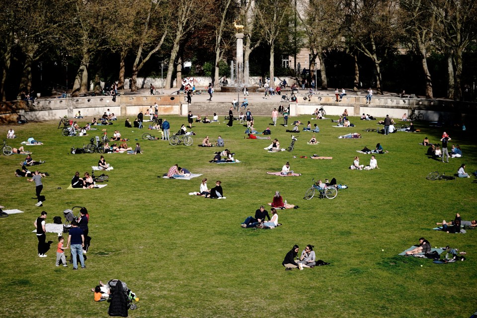 Many in Berlin sit in the Schoneberg city park this week as Germany starts to lift lockdown measures