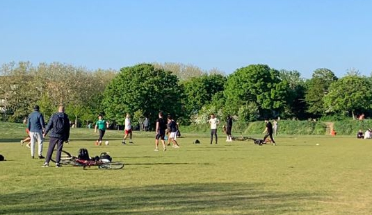  A group of men were pictured having a kickabout in a Southwark park, when they should be practising social distancing