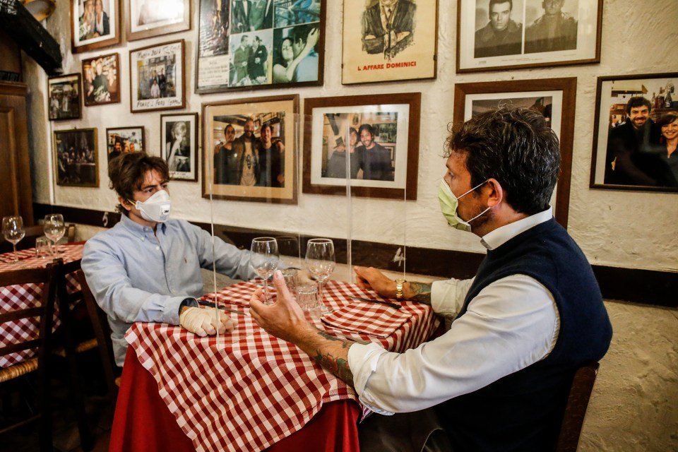 A restaurant in Rome may require their customers to enjoy a meal with a clear shield between them to help keep the number of coronavirus infections down 