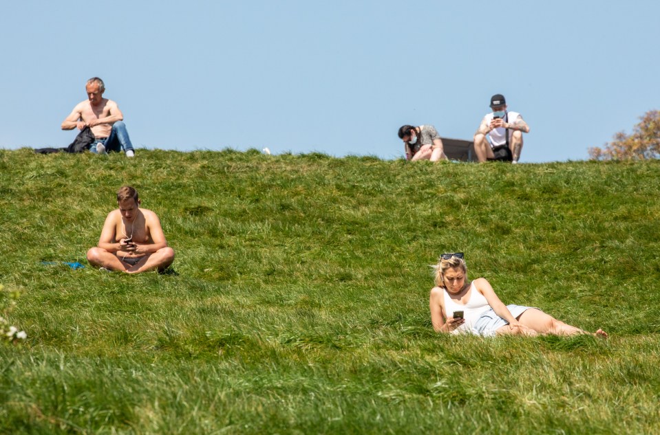  Londoners go out to Primrose Hill in the sunshine during lockdown as temperatures reach 24c