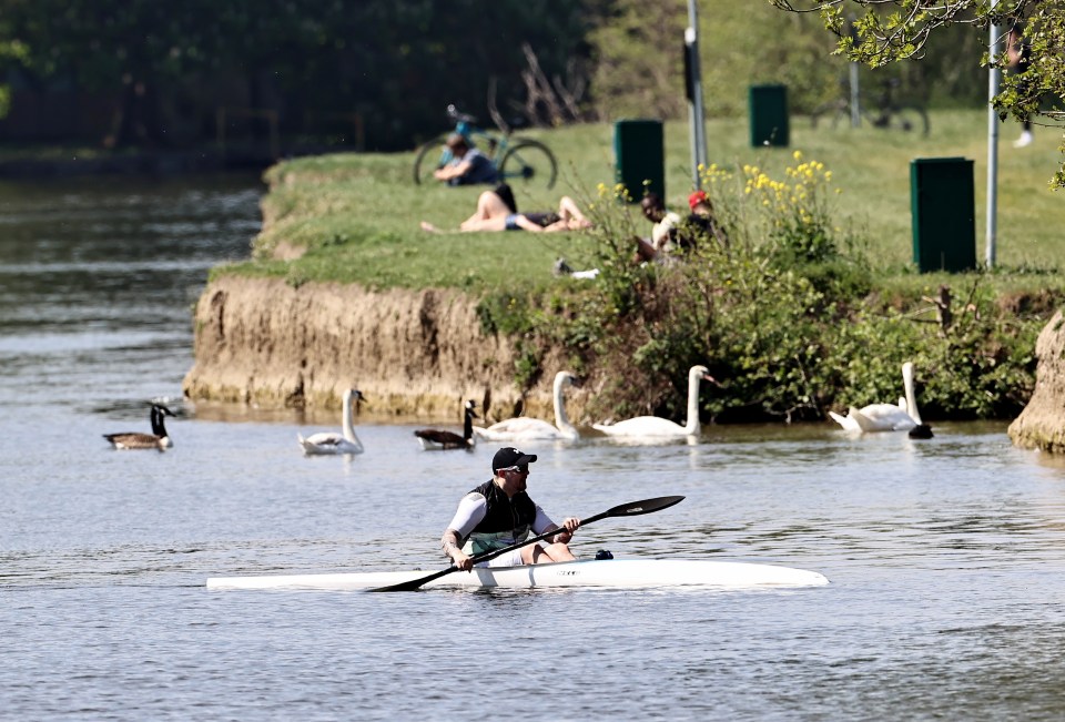  A canoeist takes a paddle at Eton Riverbank on the Thames River at Windsor Castle yesterday