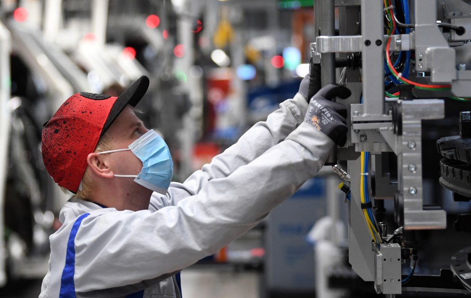 VW employees went back to work at the plant in Zwickau, Germany on April 23 but this time wearing face masks 