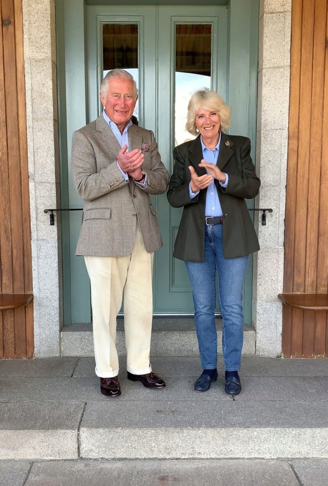 Prince Charles and his wife Camilla outside the front door of their home at Birkhall in Aberdeenshire for the Clap For Carers