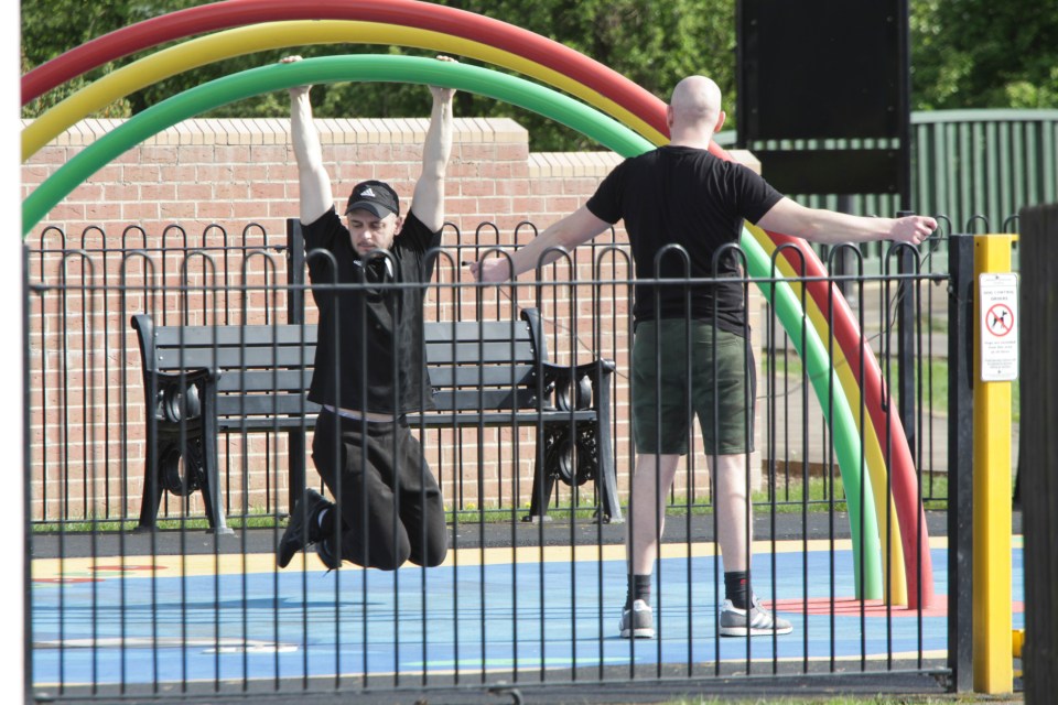  Two men were seen exercising at a park in Long Eaton, Derbys