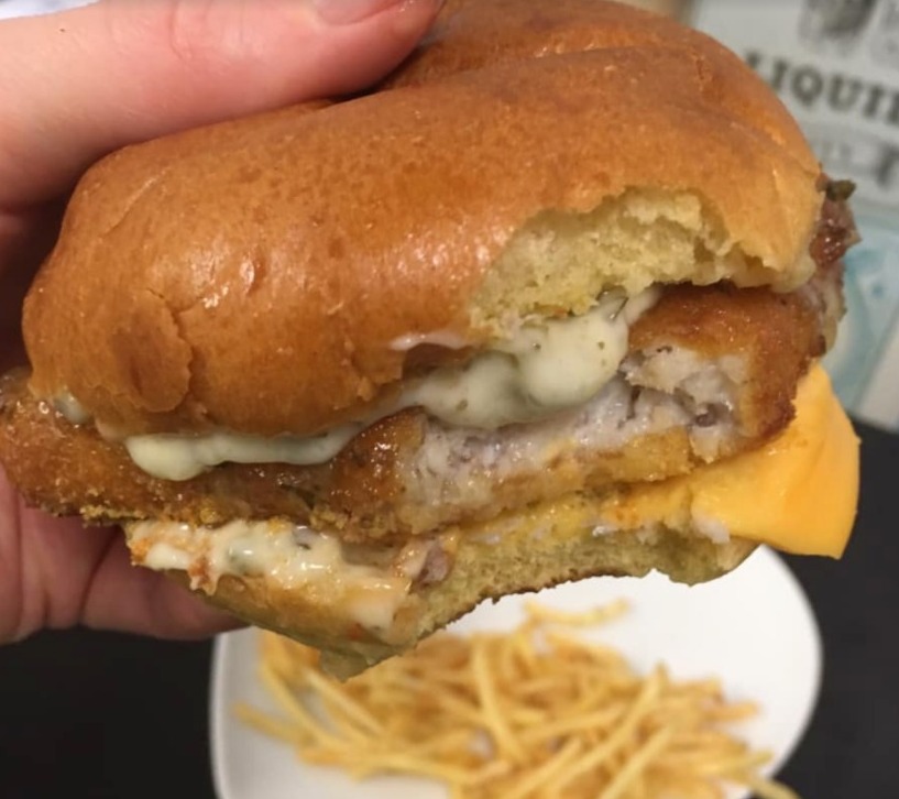 She put the patty in a brioche bun and covered in tartare sauce and cheese