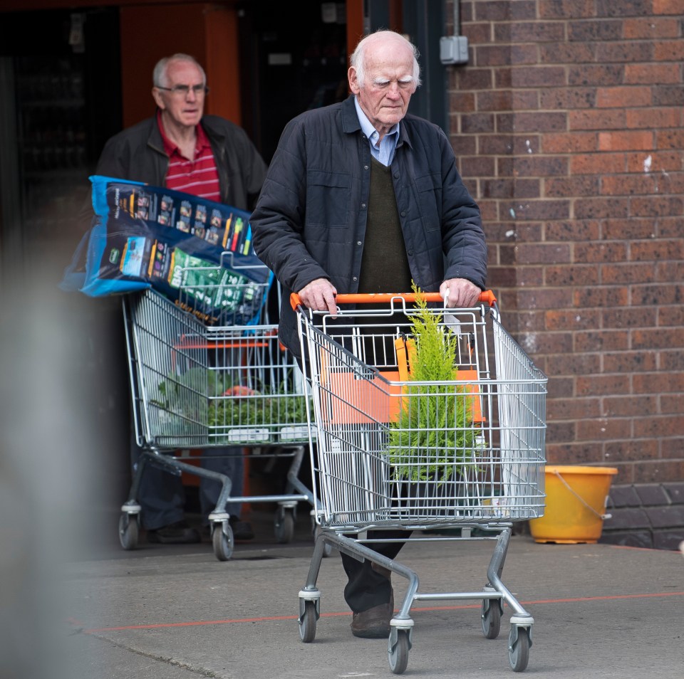  A shopper leaving B&Q in Cricklewood, North London