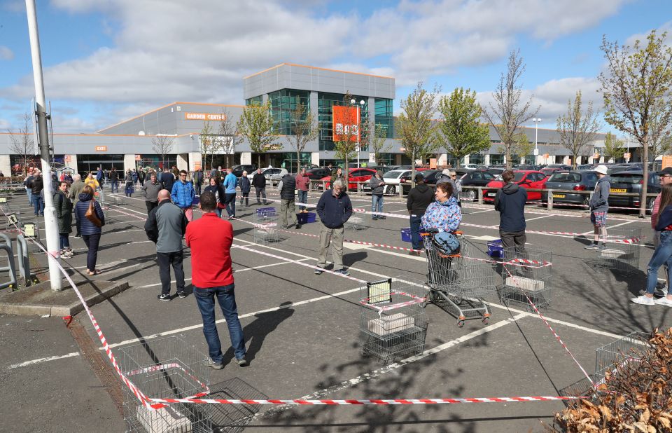 Customers queue to get into B&Q after the DIY chain re-opened its doors