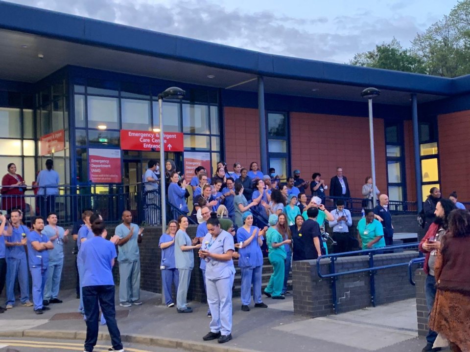  Medics are pictured clapping for key workers outside Whipps Cross Hospital - where Alex works