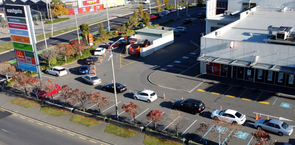 Fast food workers prepare food for drive-through in Christchurch, New Zealand’s South Island, April 28