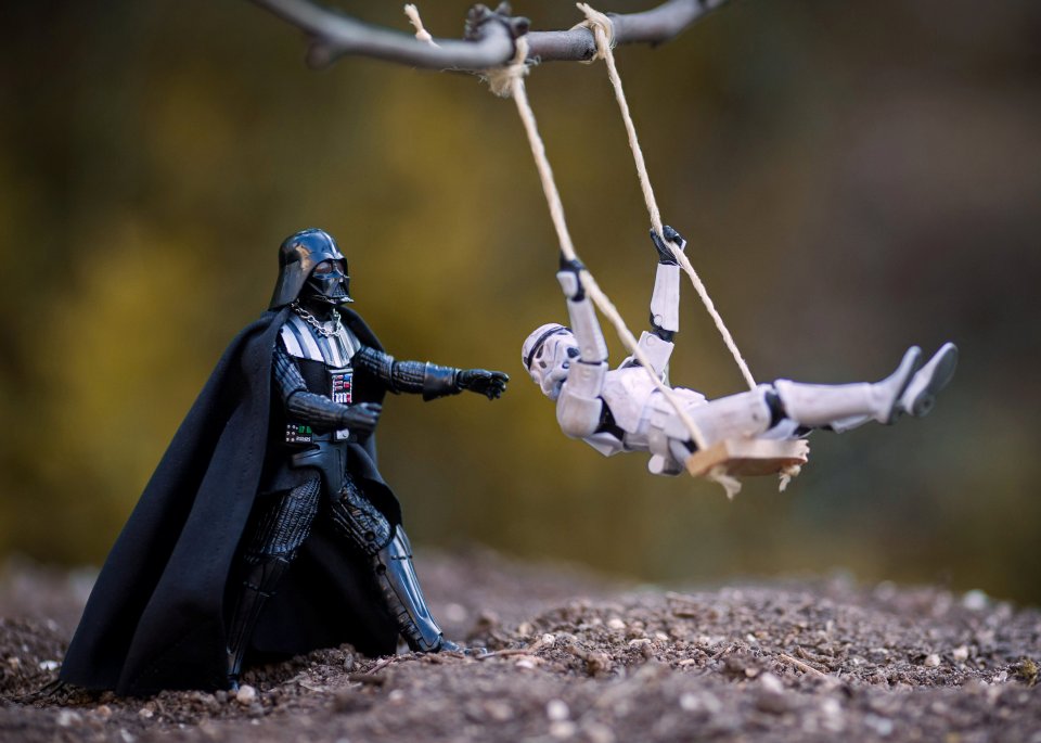 The photographer started toy photography in late 2015 — here Darth Vader pushes a Stormtrooper on a swing