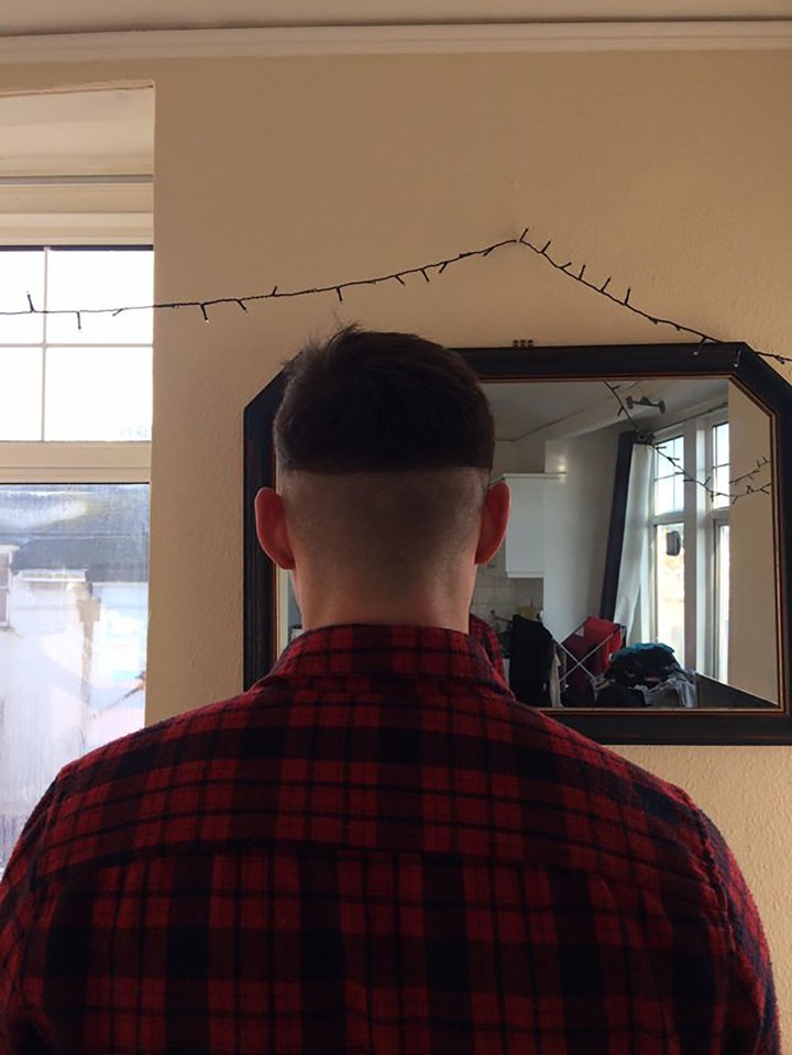 This man sports a perfectly aligned helmet-like hair cut