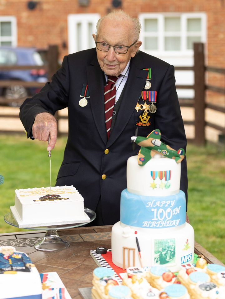  Captain Tom was seen cutting one of his birthday cakes