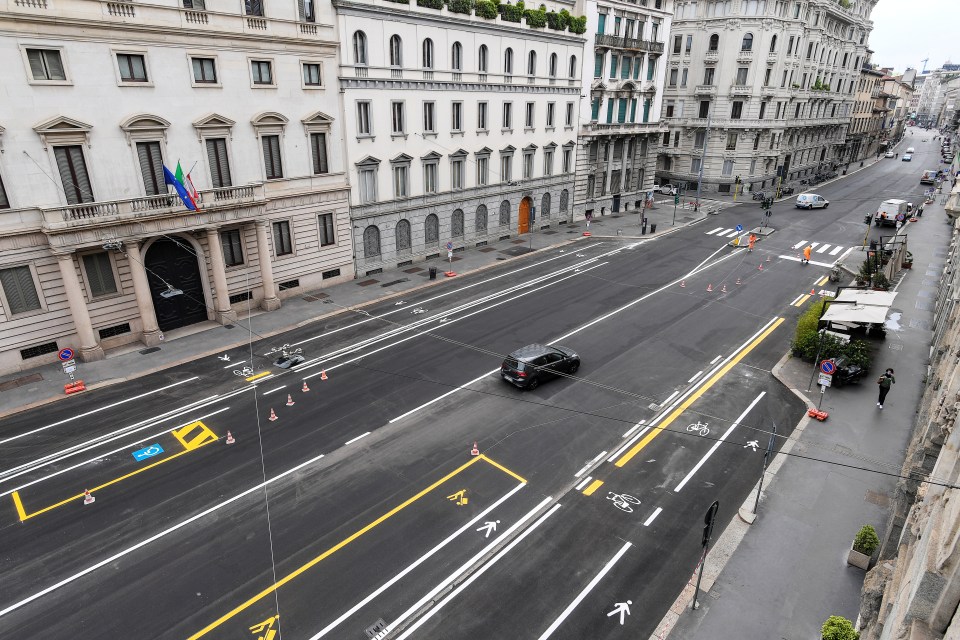 A usually gridlocked road in Milan is now deserted with bikes taking priority