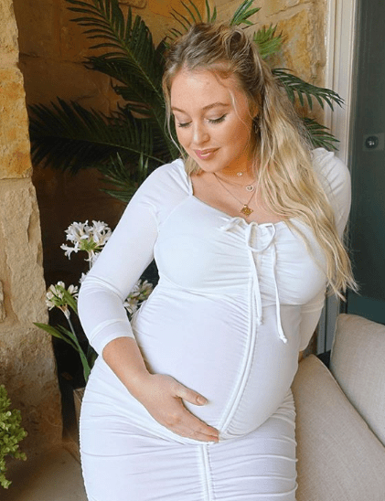  Iskra looked radiant in the Instagram snaps which saw her showing off her baby bump in a white dress