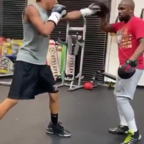  Mayweather posted a video taking his 14-year-old nephew Chris on the pads