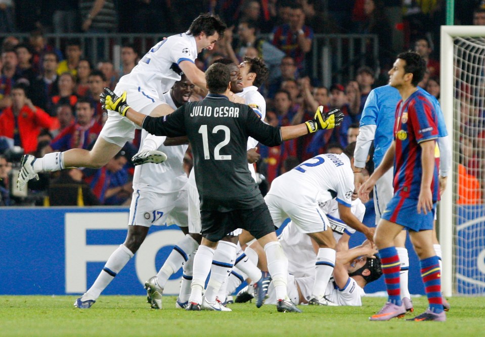  Inter Milan's Diego Milito and Brazilian goalkeeper Julio Cesar celebrate as Barcelona's Pedro looks on in 2010