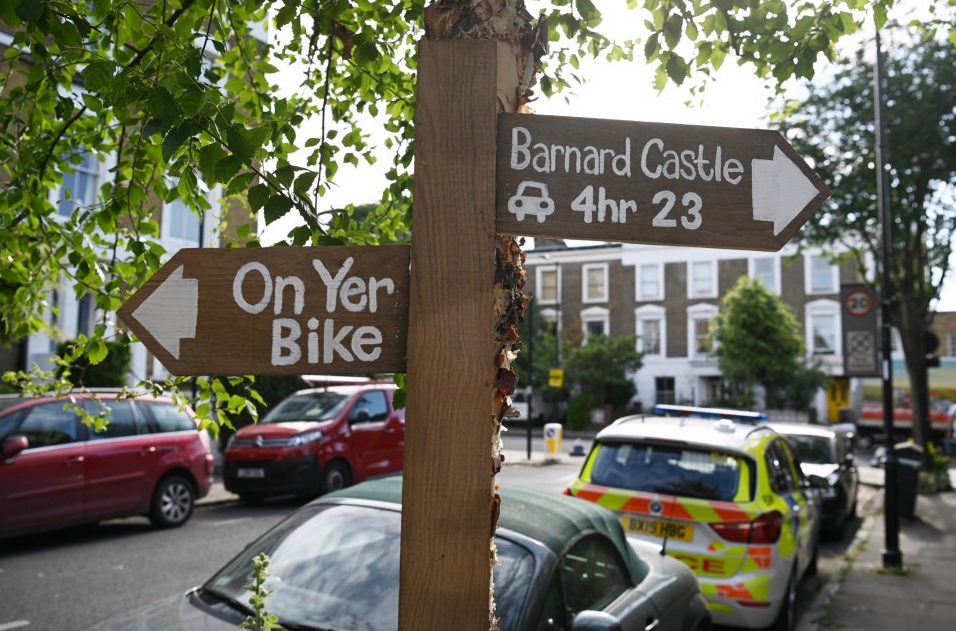 A sign left by a protester near his house