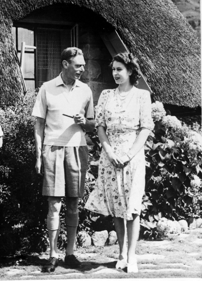  King George VI relaxing with his daughter Princess Elizabeth during a visit to Natal National Park in South Africa, two years after the end of WW2