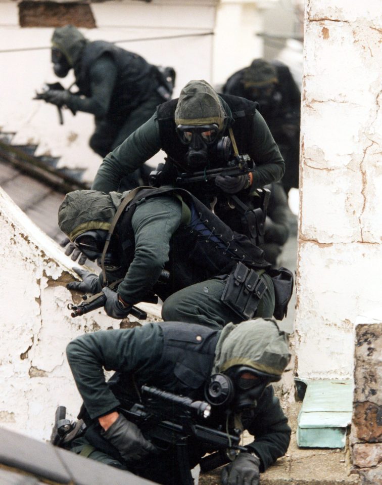  The soldiers climb in through the windows of the building