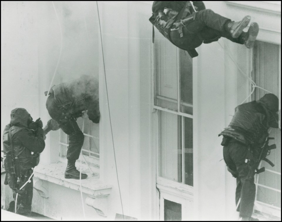  Soldiers abseiling from the roof to get to the second and third floors