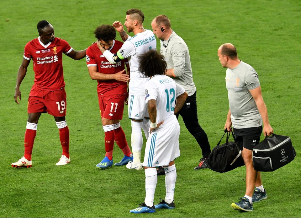 Mo Salah is helped off as Sergio Ramos appears to show sympathy