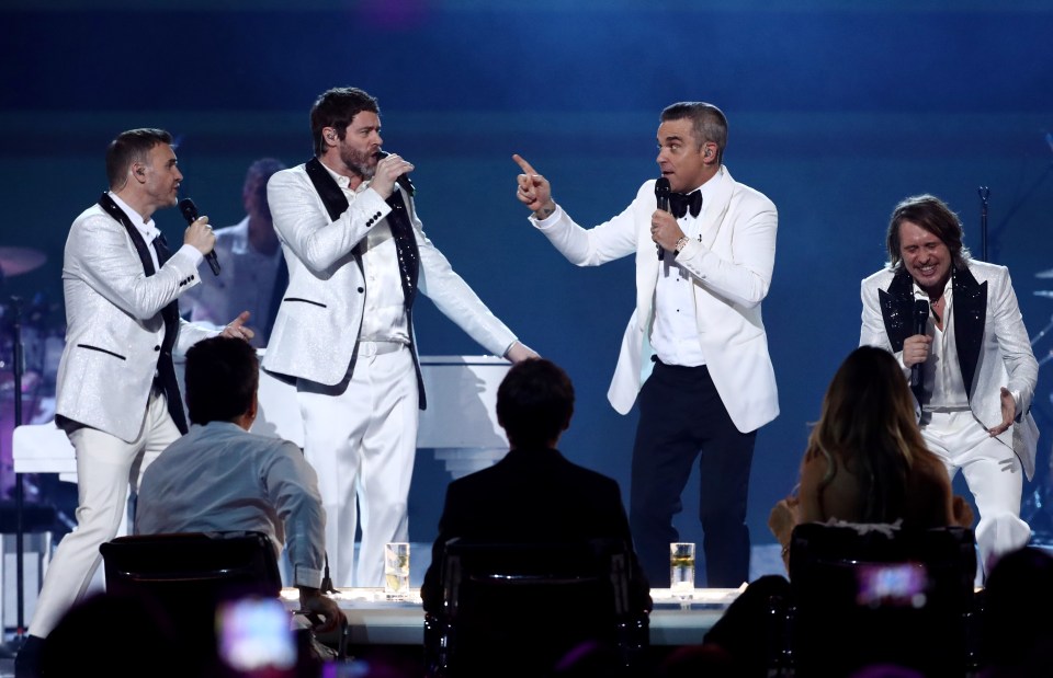  Gary Barlow, Mark Owen, Howard Donald and Robbie Williams will perform together from their homes in a bid to lift the nations spirits