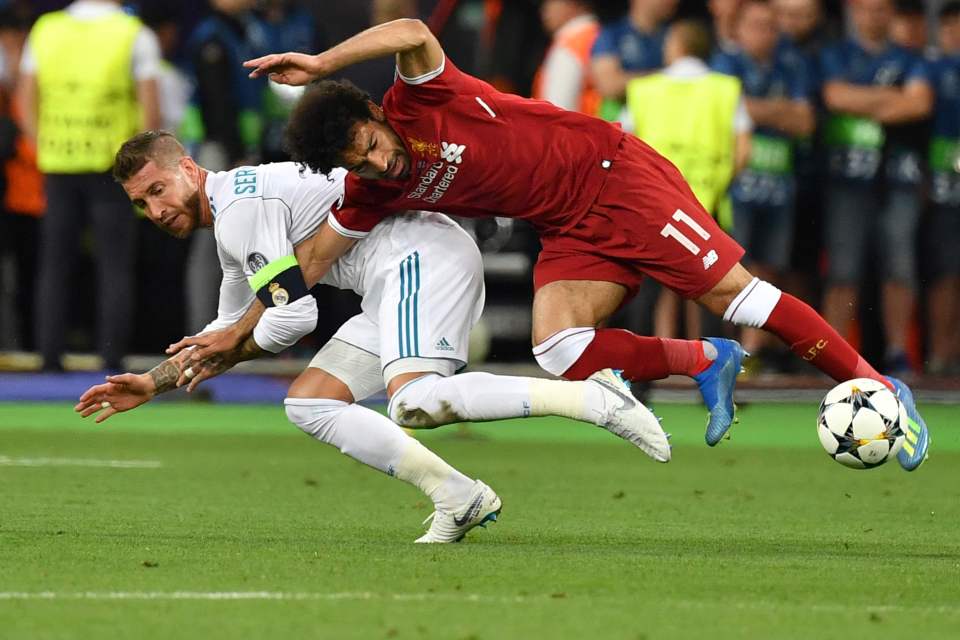 Sergio Ramos appeared to grip Mo Salah's arm inside his own as they tumbled in Kiev