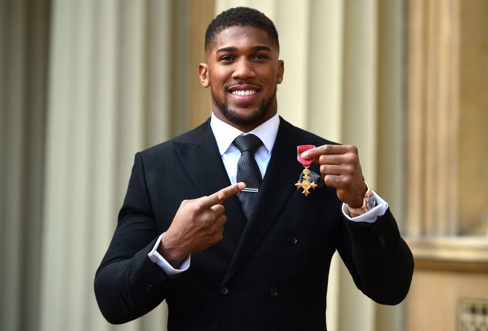  The British heavyweight poses with his OBE in 2018