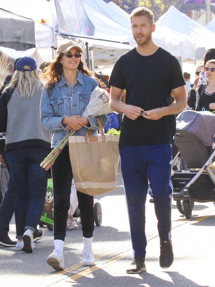  Calvin buys flowers with with girlfriend Arika Wolf last year