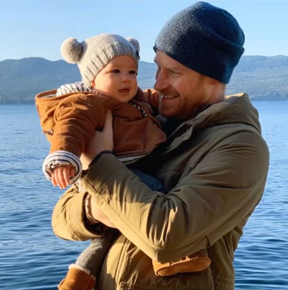  Prince Harry grins with his baby boy - who will turn one today