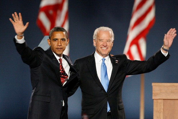 President-elect Senator Barack Obama and Vice President-elect Senator Joe Biden wave to supporters after speaking at Obama's election night rally