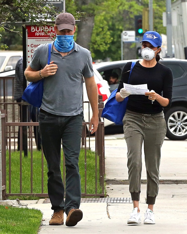  Prince Harry and Meghan, pictured in LA delivering food parcels, say helicopters regularly fly above their home