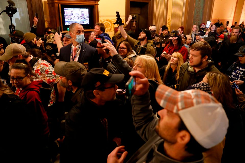  Protestors try to enter the Michigan House of Representative chamber and are being kept out by the Michigan State Police after the American Patriot Rally organized by Michigan United for Liberty protest