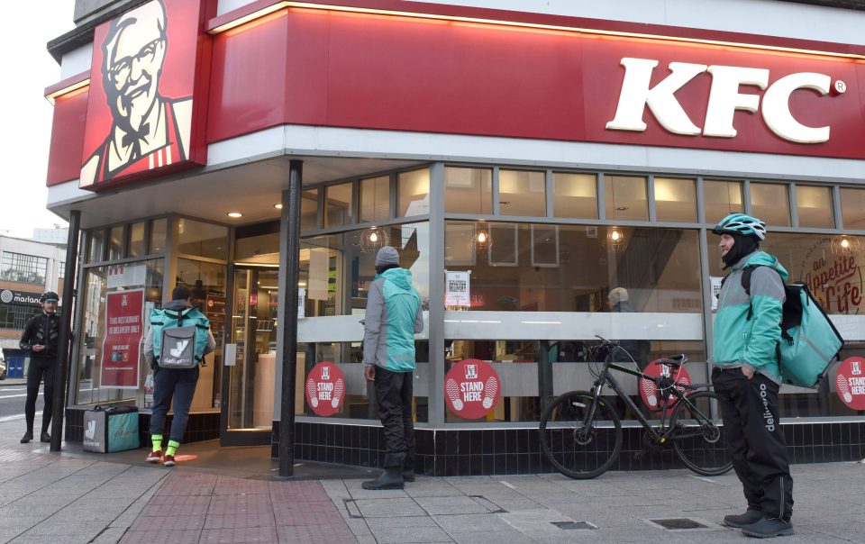  Deliveroo drivers queuing outside a KFC branch in Southampton