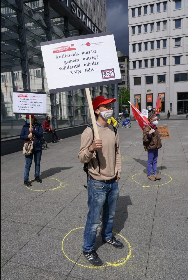  Supporters of the IG Metall labor union demonstrate while maintaining social distancing by standing in marked circles on May Day at Potsdamer Platz