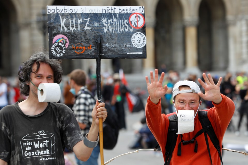  Protesters display banners during a left-wing May Day demonstration, as the spread of COVID-19 continues