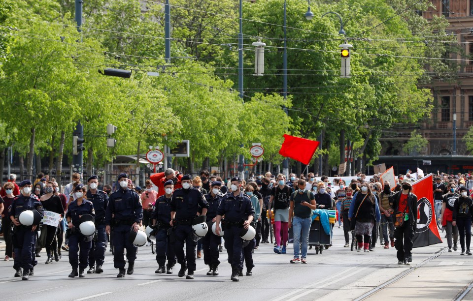  Police officers wearing masks seen during protests in Vienna