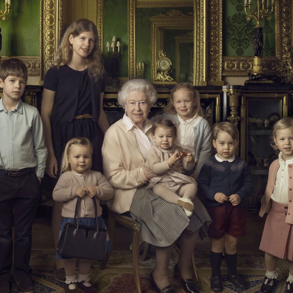 Her Majesty included this 2016 picture taken by Annie Leibovitz - with Prince William and Kate Middleton's daughter sat on her lap