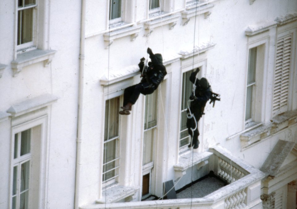  The hero soldiers abseil down from the roof before entering the building through the windows